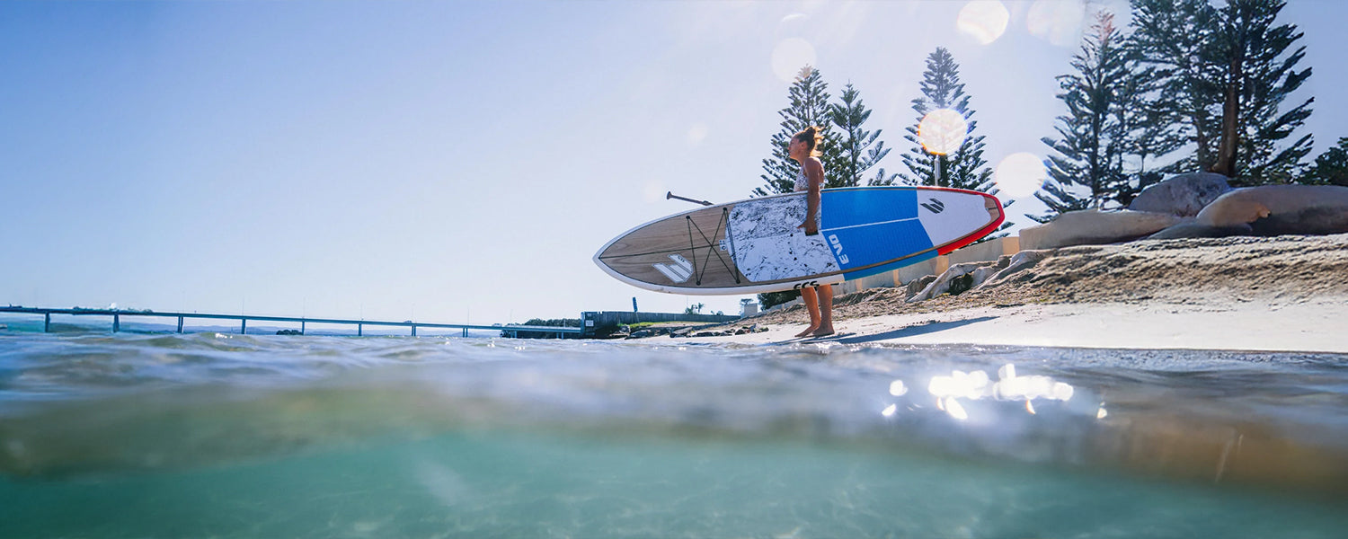 Woman standing with her kayak