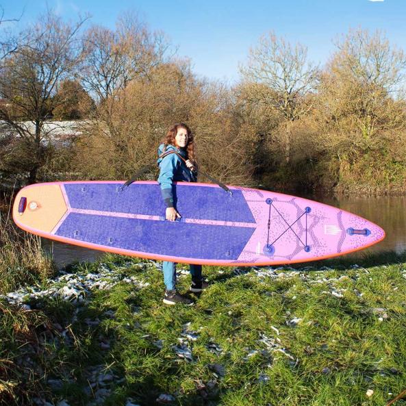Woman holding Stand-Up Paddleboard