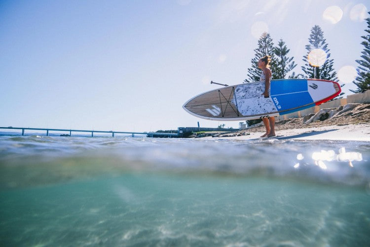 Woman standing with her kayak